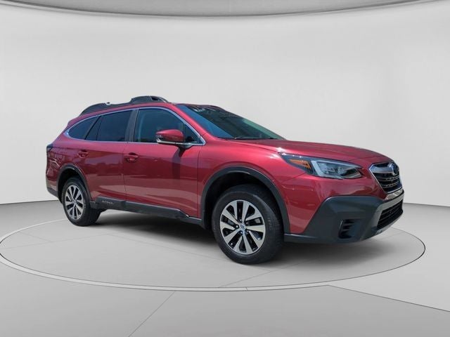 2021 Subaru Outback Premium in Crimson Red Pearl — front three-quarter view