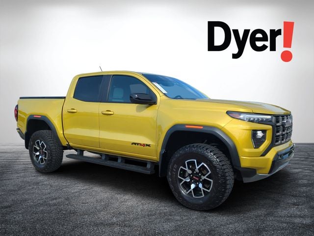 2023 GMC Canyon AT4X in Solar Flare Metallic — front three-quarter view